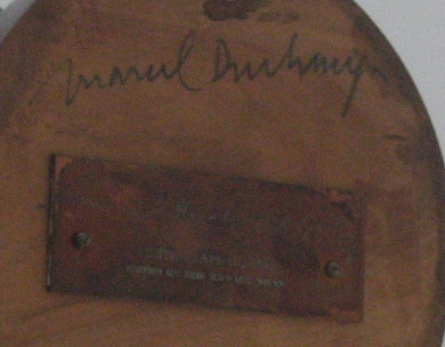Photograph of Duchamp's signature on the bottom of the hat rack